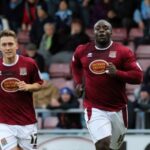 Adebayo Akinfenwa celebrates the first of his two goals against Wycombe on Saturday (Picture: Sharon Lucey)